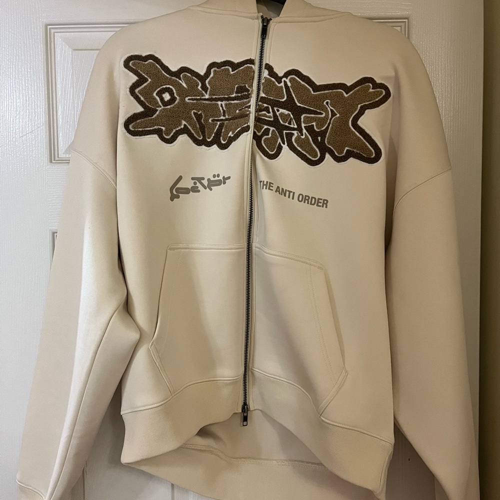 Loiter x anti order cream sweater